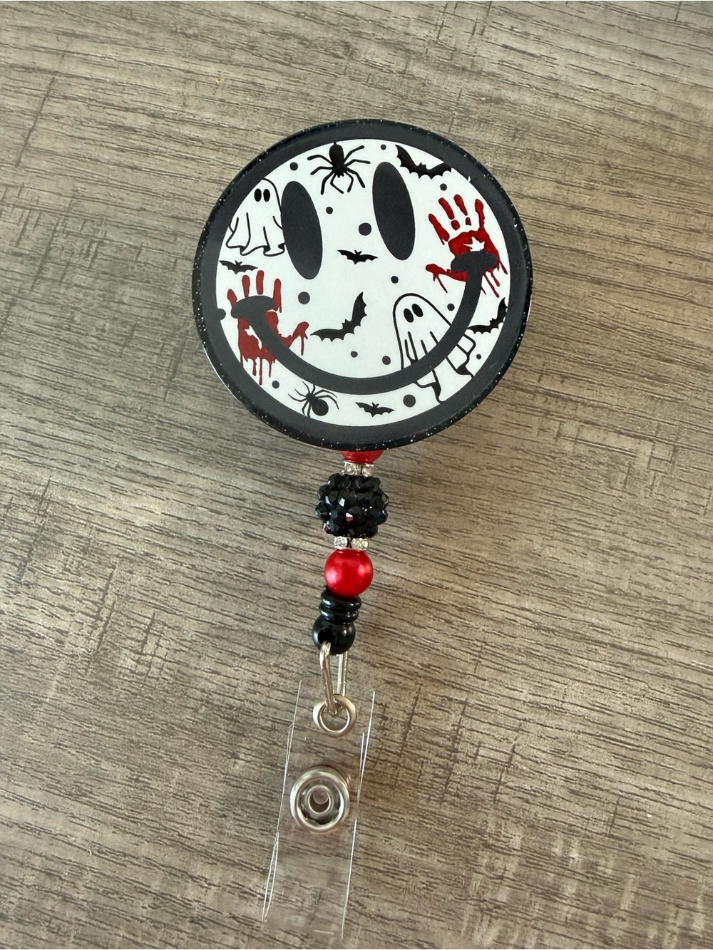 Spooky Smile Badge Reel - Black, White & Red